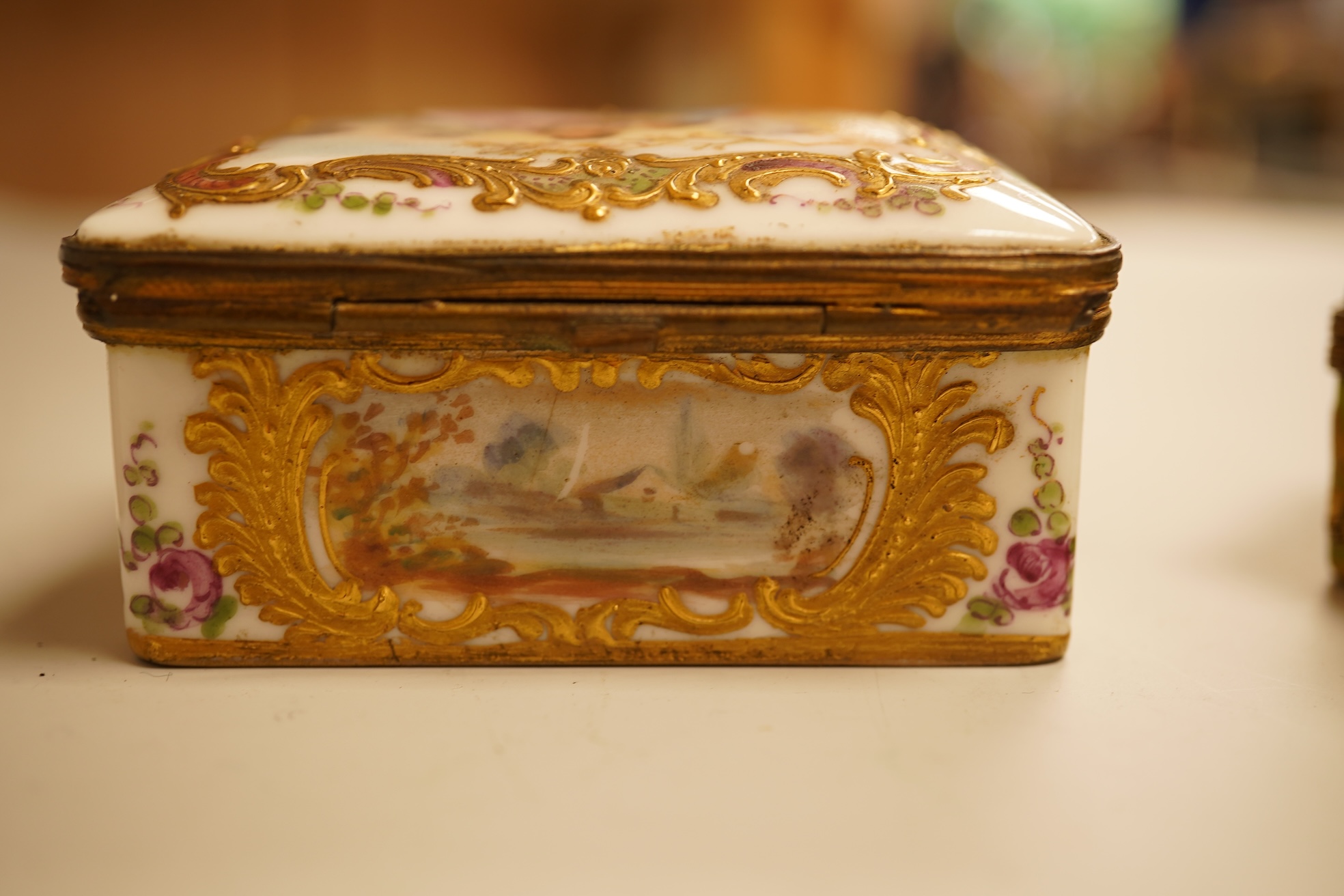 A Zsolnay lustre 'chicken' box and cover and two Sevres style porcelain boxes and covers (3) ‘chicken box’ 5cm diameter.